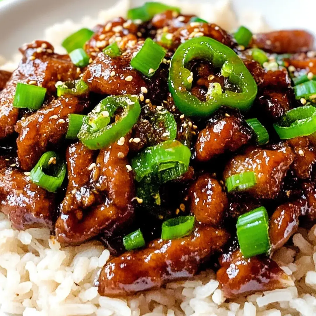 A plate of food with rice and meat.