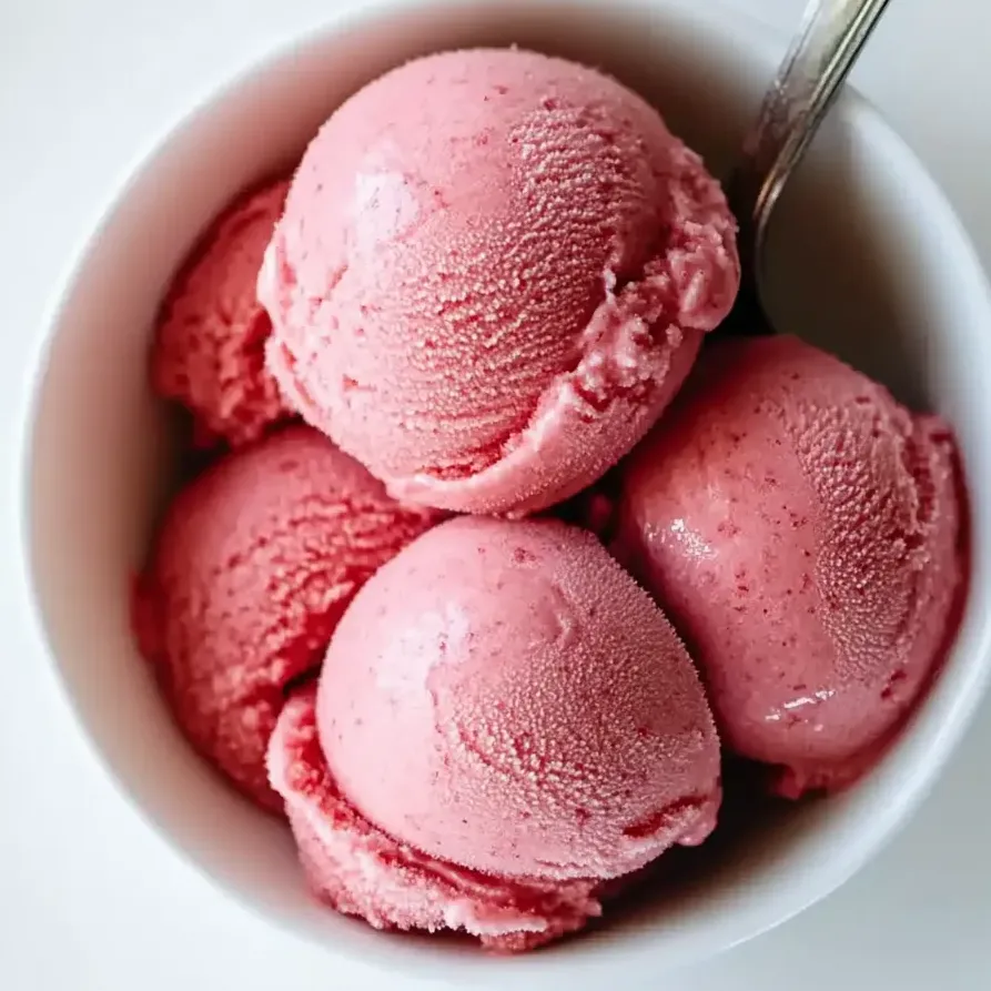 A bowl of homemade strawberry frozen yogurt.