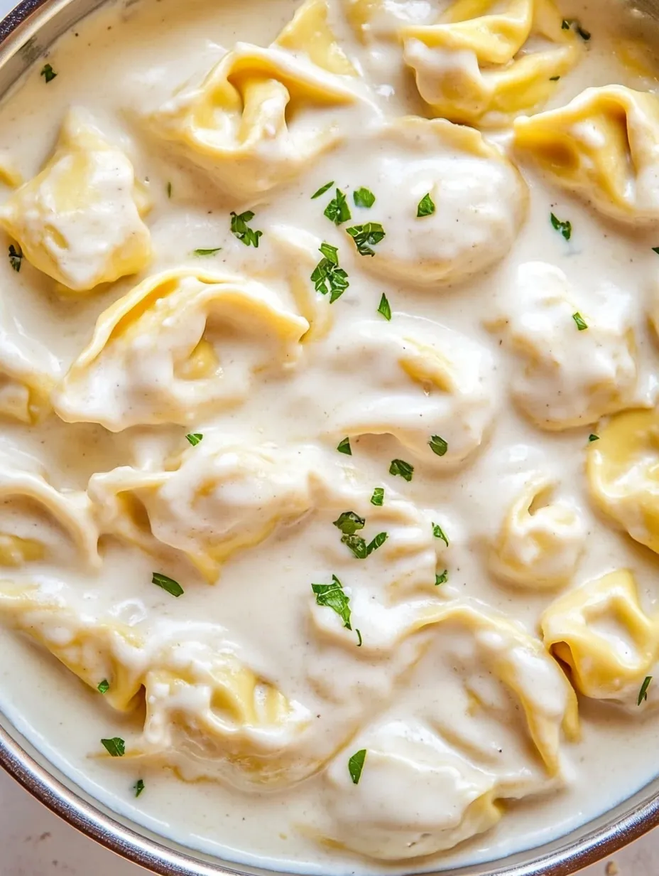 A bowl of garlic Parmesan tortellini pasta recipe.