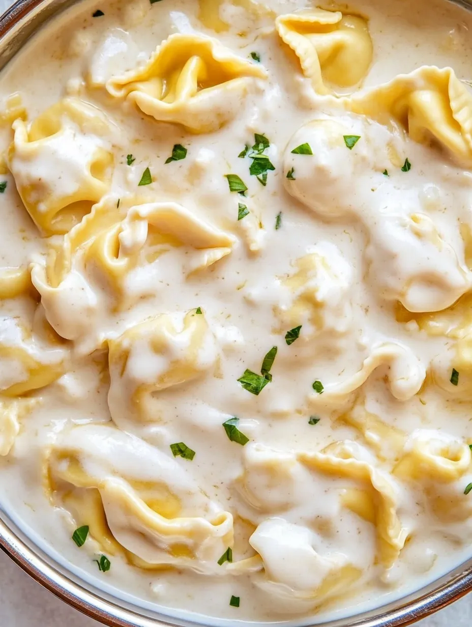A bowl of garlic Parmesan tortellini pasta.