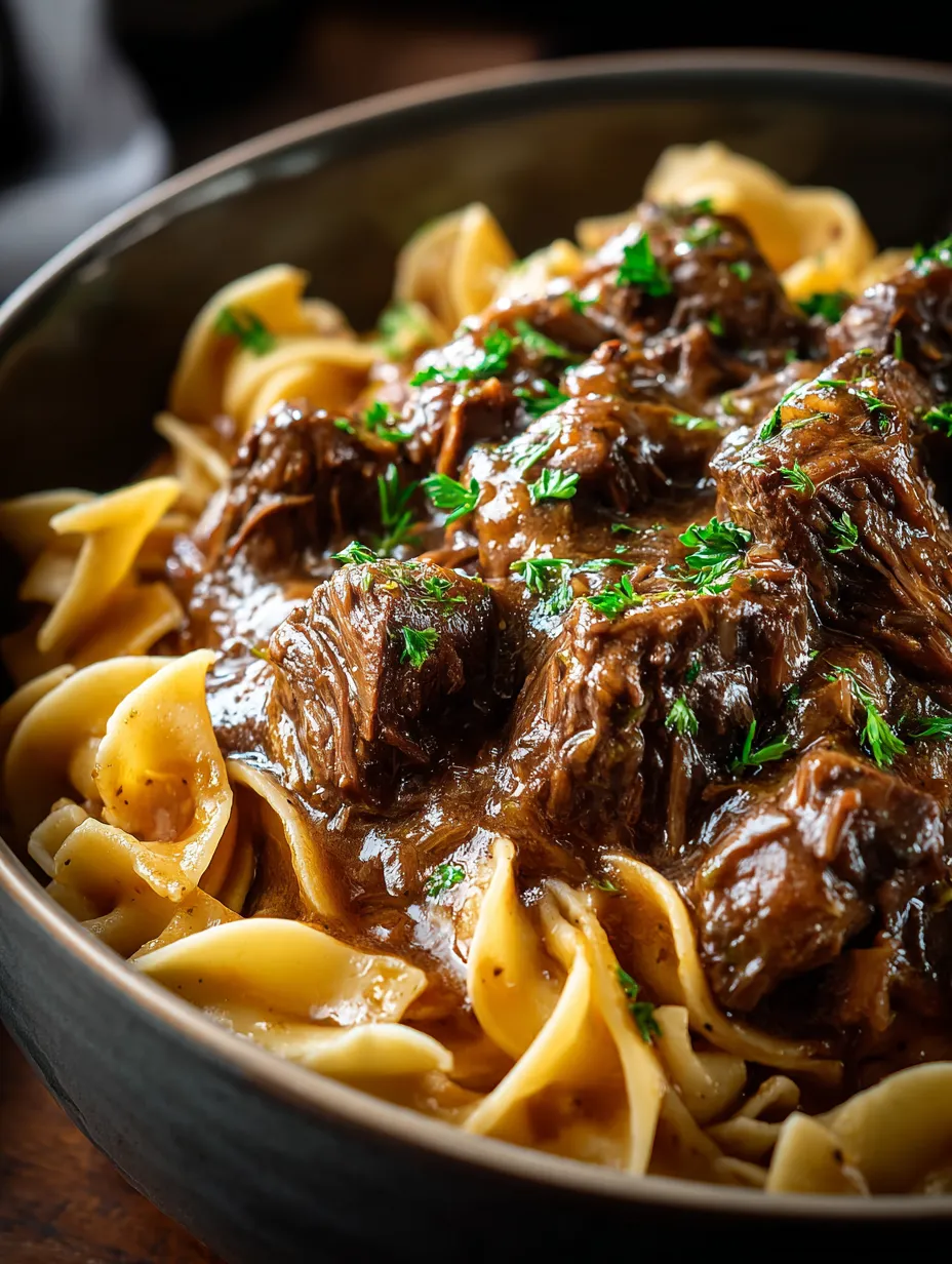 A bowl of pasta with meat sauce.
