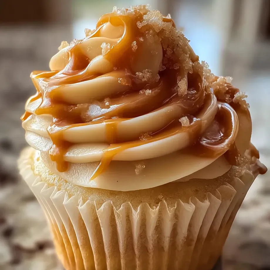 A cupcake with caramel frosting.