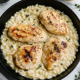 A dish of chicken with rice and Parmesan cheese.