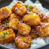 A bowl of crispy honey garlic tofu.