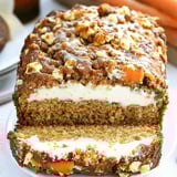 A slice of carrot loaf cake with cream filling.