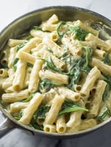 A delicious meal of pasta with spinach and cheese.