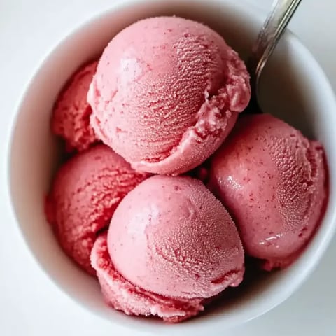 A bowl of homemade strawberry frozen yogurt.