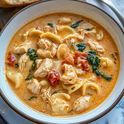 A bowl of creamy Tuscan chicken soup.